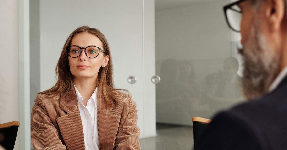 Business professionals engaged in a focused meeting in a modern office setting